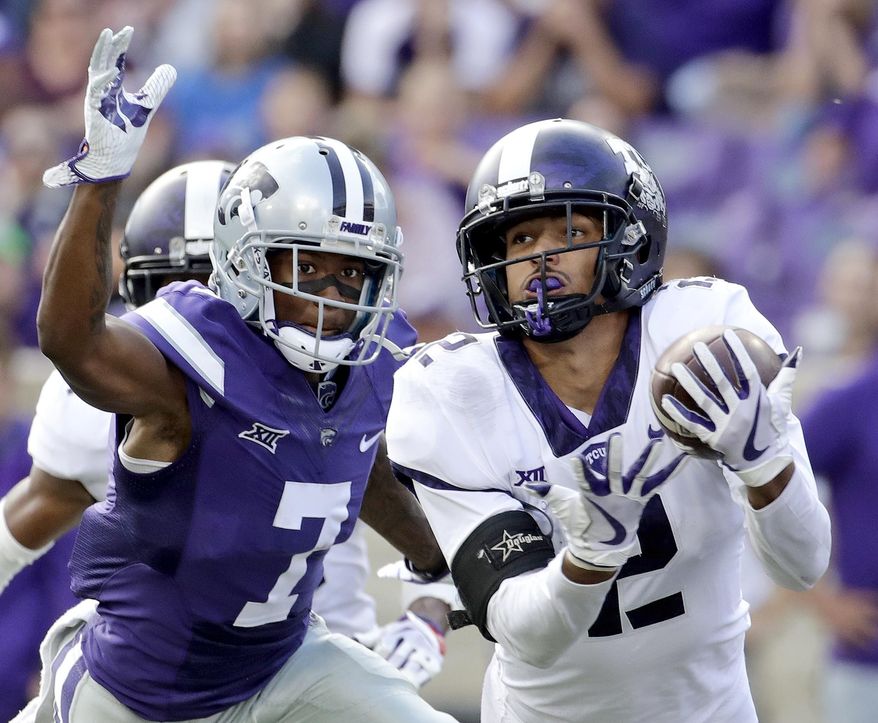 FILE - In this Oct. 14, 2017, file photo, TCU safety Niko Small (2) breaks up a pass intended for Kansas State wide receiver Isaiah Zuber (7) during the second half of an NCAA college football game, in Manhattan, Kan. (AP Photo/Charlie Riedel, File)