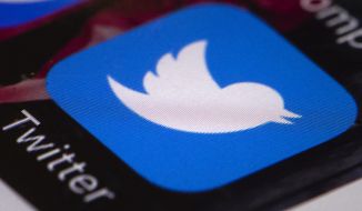 This April 26, 2017, file photo shows the Twitter app on a mobile phone in Philadelphia. Russian agents on Twitter attempted to deflect bad news around President Trump&#39;s election campaign in October 2016 and refocused criticism on the mainstream media and the Clinton campaign, according to an exclusive AP analysis of an archive of deleted accounts. (AP Photo/Matt Rourke, File)