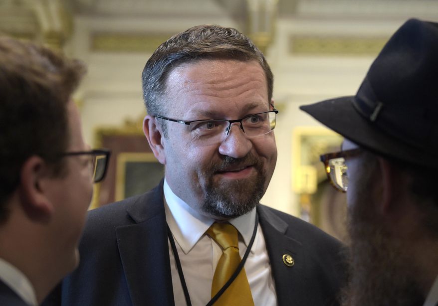 In this Tuesday, May 2, 2017, file photo, then-deputy assistant to President Trump, Sebastian Gorka, talks with people in the Treaty Room in the Eisenhower Executive Office Building on the White House complex in Washington during a ceremony commemorating Israeli Independence Day. (AP Photo/Susan Walsh, File)