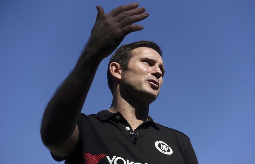 Former Chelsea player Frank Lampard speaks to journalists after giving a soccer coaching session to children at an ambassador's residence garden of British Embassy in Tokyo, Thursday, Nov. 9, 2017. (AP Photo/Eugene Hoshiko)