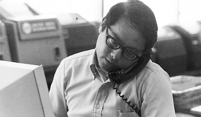 This 1980s photo provided by the family shows Gordon Sakamoto, former Associated Press bureau chief in Honolulu, at work in the UPI bureau in Honolulu . Sakamoto died at his Honolulu home Wednesday, Nov. 8, 2017, after heart failure and a long battle with chronic kidney disease, his son Kyle Sakamoto said. He was 82 years old. Honolulu-born Sakamoto was named chief of bureau in 1994, overseeing AP operations in Hawaii and the Central Pacific. He joined the AP after working for five years as a marketing specialist for the state of Hawaii and had worked for UPI for 27 years in San Francisco and Hawaii. (Courtesy Sakamoto Family via AP)