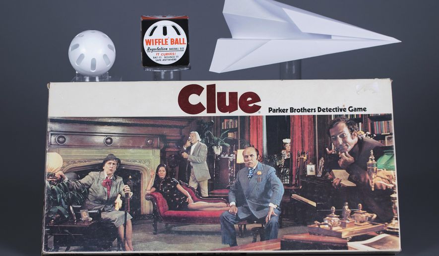 This undated photo provided by The Strong shows the three toys inducted into the National Toy Hall of Fame Class of 2017, from top left, the Wiffle Ball, the paper airplane and the board game Clue. The trio was honored at the upstate New York hall on Thursday, Nov. 9, 2017. (Victoria Gray/The Strong via AP)