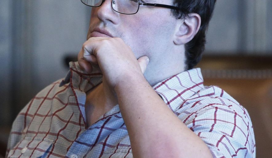 Graig Burrier sits in the courtroom during a hearing Wednesday, Nov. 8, 2017 in the Summit County Common Please Court in Akron, Ohio. An Ohio judge must decide how to deal with Burrier, a man who has been diagnosed with autism and has repeatedly violated his probation for sexual battery by asking women to touch their bellybuttons. Burrier, 29, pleaded guilty Wednesday to a probation violation after approaching a female jogger and asking to see her bellybutton on two days in July. (Karen Schiely, Akron Beacon Journal via AP)