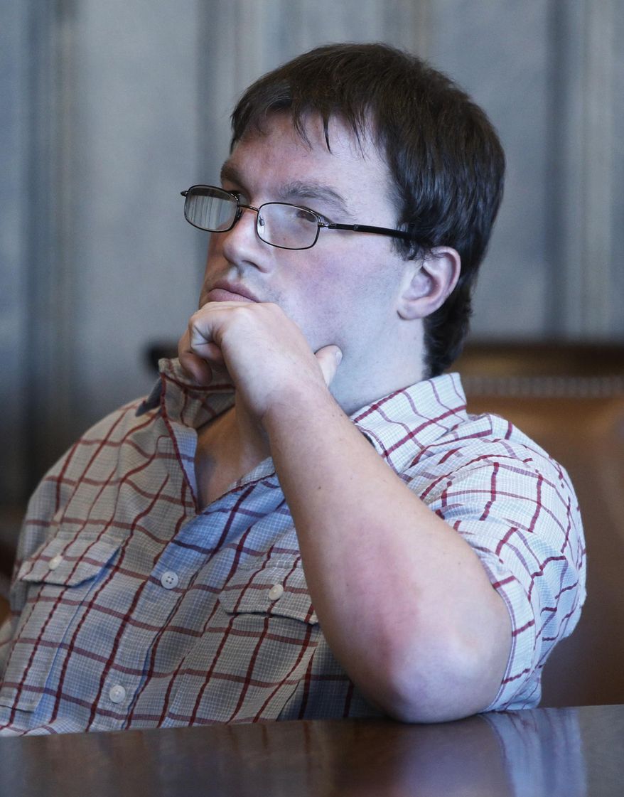 Graig Burrier sits in the courtroom during a hearing Wednesday, Nov. 8, 2017 in the Summit County Common Please Court in Akron, Ohio. An Ohio judge must decide how to deal with Burrier, a man who has been diagnosed with autism and has repeatedly violated his probation for sexual battery by asking women to touch their bellybuttons. Burrier, 29, pleaded guilty Wednesday to a probation violation after approaching a female jogger and asking to see her bellybutton on two days in July. (Karen Schiely, Akron Beacon Journal via AP)