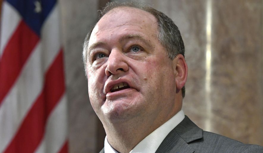 FILE - In this Jan. 3, 2017 file photo, Jeff Hoover looks up to the cheers from the gallery following his swearing in Frankfort, Ky. Kentucky's former Republican House speaker has been hospitalized days after resigning his leadership position amid sexual harassment allegations. A family member says Hoover had a heart-related issue and has asked for privacy until they issue a further statement. (AP Photo/Timothy D. Easley, File)