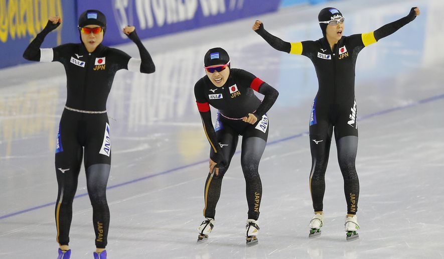 Japan's Miho Takagi, Ayana Sato, and Nana Takagi, from left, celebrate setting a new world record during the women's team pursuit race of the Speedskating World Cup at the Thialf ice rink in Heerenveen, Netherlands, Friday, Nov. 10, 2017. (AP Photo/Peter Dejong)