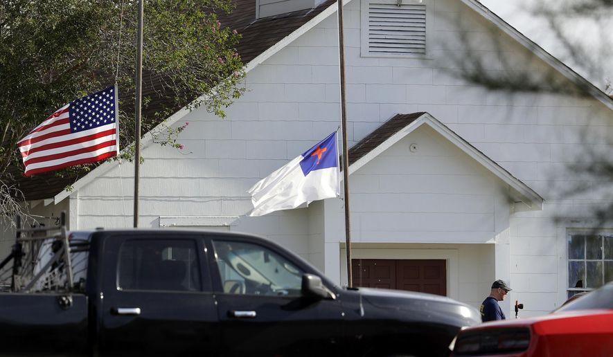 FILE - In this Nov. 7, 2017, file photo, flags fly at half-staff as law enforcement officials continue to investigate the scene of a shooting at the First Baptist Church of Sutherland Springs in Sutherland Springs, Texas. The AP reported on Nov. 10, 2017, that a story claiming a man who killed more than two dozen people at the church on Sunday was a member of an anti-fascist movement intent on causing a civil war was false. (AP Photo/Eric Gay, File)