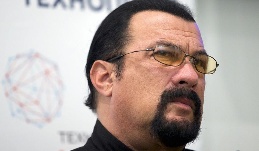 In this Sept. 22, 2015, file photo, actor Steven Seagal speaks at a news conference, while attending an opening ceremony for a research and development center in Moscow, Russia. Jenny McCarthy said on her Sirius XM show Nov. 9, 2017, that Seagal sexually harassed her during an audition in 1995. A Seagal spokesman has denied the McCarthy’s accusations to The Daily Beast. (AP Photo/Ivan Sekretarev, File)