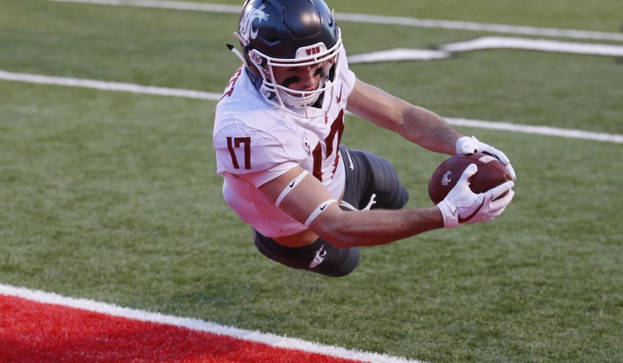 Washington State wide receiver Kyle Sweet (17) dives for a touchdown against Utah in the first half of an NCAA college football game, Saturday, Nov. 11, 2017, in Salt Lake City. (AP Photo/Rick Bowmer)
