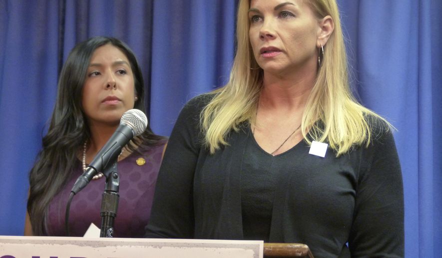Domestic violence survivor Nicole Beverly speaks during a news conference at the House Office Building Thursday, Nov. 9, 2017 in Lansing, Mich. She supports newly introduced legislation aimed at helping victims with address confidentiality and other protections. At left is a bill sponsor, Democratic Rep. Vanessa Guerra of Saginaw. (AP Photo/David Eggert)