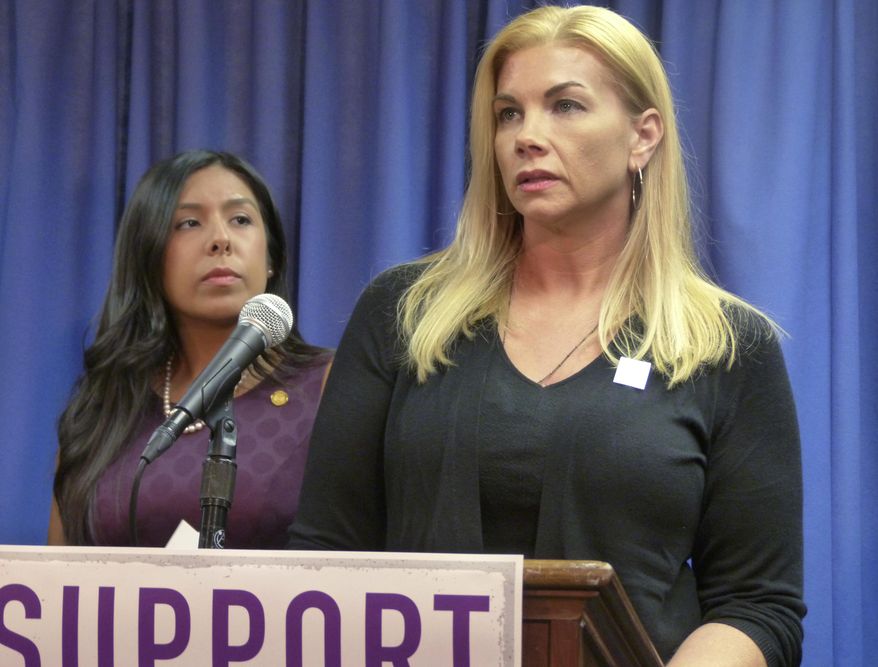 Domestic violence survivor Nicole Beverly speaks during a news conference at the House Office Building Thursday, Nov. 9, 2017 in Lansing, Mich. She supports newly introduced legislation aimed at helping victims with address confidentiality and other protections. At left is a bill sponsor, Democratic Rep. Vanessa Guerra of Saginaw. (AP Photo/David Eggert)
