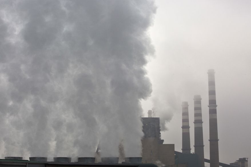 Smoke and steam billow from the chimneys of the Kosovo A power plant, near Obilic, Kosovo, Friday, Nov. 10, 2017. The COP 23 Fiji UN Climate Change Conference is taking place in Bonn, Germany. The two-week meeting that started Monday is the first major conference on climate change since President Donald Trump said that the U.S. will pull out of the Paris accord unless his administration can secure a better deal. (AP Photo/Visar Kryeziu)