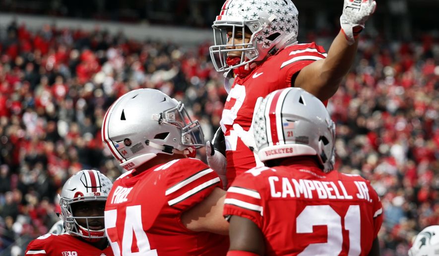 Ohio State running back J.K. Dobbins celebrates his touchdown against Michigan State during the first half of an NCAA college football game Saturday, Nov. 11, 2017, in Columbus, Ohio. (AP Photo/Jay LaPrete)
