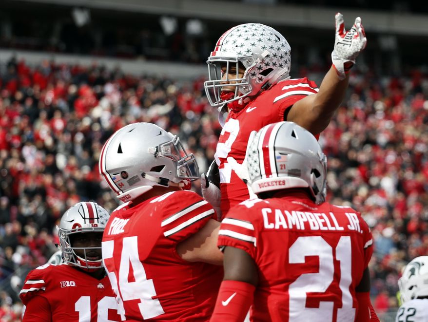 Ohio State running back J.K. Dobbins celebrates his touchdown against Michigan State during the first half of an NCAA college football game Saturday, Nov. 11, 2017, in Columbus, Ohio. (AP Photo/Jay LaPrete)