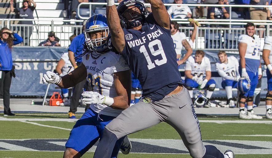Nevada receiver Wyatt Demps (19) makes a catch over San Jose State' Andre Chachere in the first half of an NCAA college football game in Reno, Nev. Saturday, Nov. 11, 2017. (AP Photo/Tom R. Smedes)