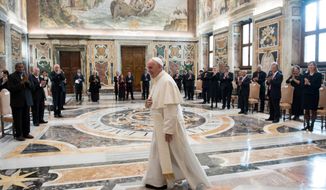 Pope Francis walks in the Clementine Hall after meeting with a delegation of Pacific leaders to discuss climate issues, at the Vatican, Saturday, Nov. 11, 2017. Francis met Saturday with a delegation of Pacific leaders and told them he shares their concerns about rising sea levels and increasingly intense storms that are threatening their small islands. (L&#39;Osservatore Romano/Pool Photo via AP)