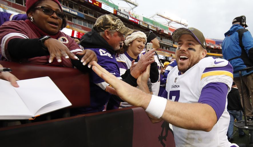 Minnesota Vikings quarterback Case Keenum (7) greets fans after an NFL football game against the Washington Redskins in Landover, Md., Sunday, Nov. 12, 2017. The Vikings defeated the Redskins 38-30. (AP Photo/Alex Brandon)