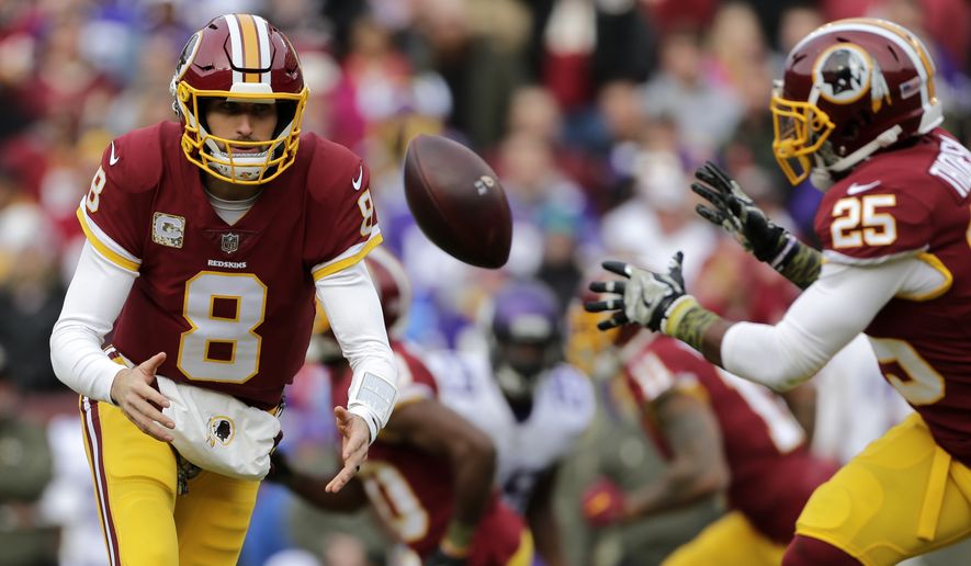 Washington Redskins quarterback Kirk Cousins (8) pitches the ball to running back Chris Thompson (25) during an NFL football game against the Minnesota Vikings, Sunday, Nov. 12, 2017, in Landover, Md. (AP Photo/Mark Tenally)