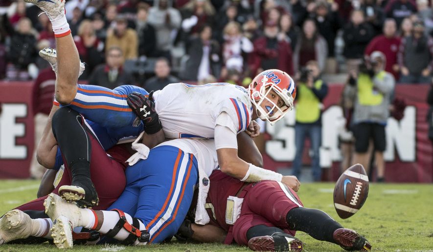Florida quarterback Feleipe Franks (13) watches a batted pass attempt against South Carolina during the second half of an NCAA college football game Saturday, Nov. 11, 2017, in Columbia, S.C. South Carolina defeated Florida 28-20. (AP Photo/Sean Rayford)