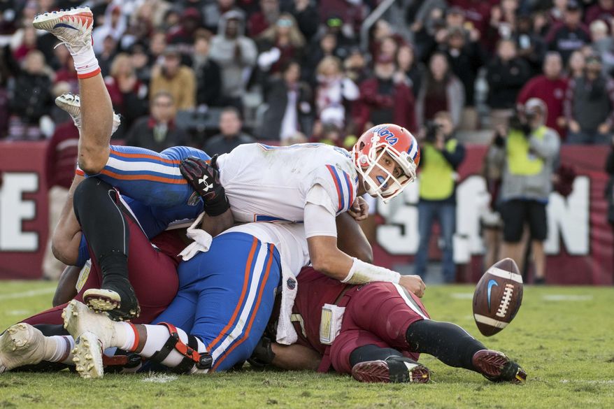Florida quarterback Feleipe Franks (13) watches a batted pass attempt against South Carolina during the second half of an NCAA college football game Saturday, Nov. 11, 2017, in Columbia, S.C. South Carolina defeated Florida 28-20. (AP Photo/Sean Rayford)