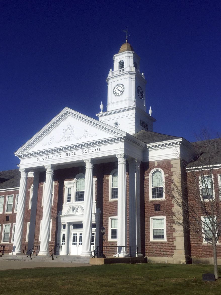 This Sept. 21, 2017 photo provided by David Totty shows tower clock atop Spaulding High School in Rochester, N.H. After it quit working during the summer, Paul Dumont, a retired county commissioner with a background in electronics, came to the rescue and restored the tower clock again, nearly 20 years after he first restored it in 1999. (David Totty via AP)