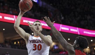 Virginia forward Jay Huff (30) shoots over Austin Peay guard Terry Taylor (21) during an NCAA college basketball game Monday, Nov. 13, 2017, in Charlottesville, Va. (Andrew Shurtleff/The Daily Progress via AP)