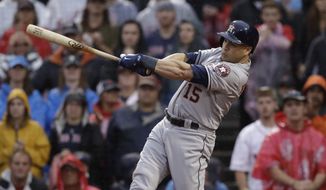 FILE - In this Oct. 9, 2017, file photo, Houston Astros designated hitter Carlos Beltran takes a swing during the ninth inning of Game 4 of baseball&#x27;s American League Division Series, in Boston. Beltran is retiring after winning his first World Series title in his 20th major league season. The 40-year-old made the announcement Monday, Nov. 13, 2017, 12 days after the Houston Astros beat the Los Angeles Dodgers in Game 7 of the World Series. (AP Photo/Charles Krupa, File) **FILE**