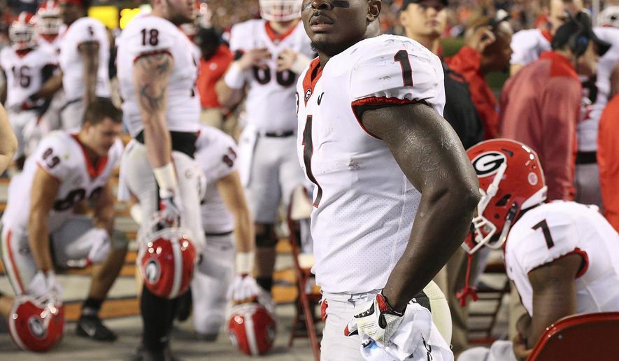 Georgia tailback Sony Michel stands on the sidelines watching while Auburn scores a touchdown in the third quarter of an NCAA college football game at Jordan-Hare Stadium, Saturday, Nov. 11, 2017, in Auburn, Ala. (Curtis Compton/Atlanta Journal-Constitution via AP)