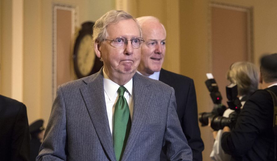 &quot;We&#39;re optimistic that inserting the individual mandate repeal would be helpful,&quot; said Senate Majority Leader Mitch McConnell, Kentucky Republican, said of the tax bill. (Associated Press/File)