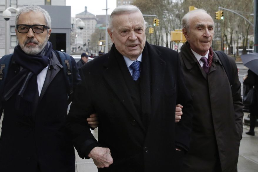 Jose Maria Marin, center, from Brazil, arrives at federal court for the first day of his trial, in the Brooklyn borough of New York, Monday, Nov. 13, 2017. He is one of three former South American soccer officials who are going on trial in a U.S. case highlighting widespread corruption in the sport's governing body. (AP Photo/Richard Drew)