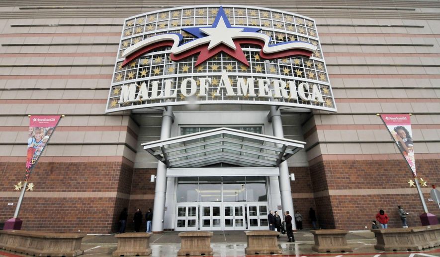FILE - In this Oct. 27, 2010, file photo, an entrance to the Mall of America is seen in Bloomington, Minn. Police say two people were stabbed in the mall on Nov. 12, 2017, in what investigators say was an "interrupted theft."(AP Photo/Jim Mone, File)