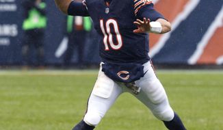 Chicago Bears Mitchell Trubisky (10) throws on the run against the Green Bay Packers on Sunday, Nov. 12, 2017, during an NFL football game in Chicago. (Daniel White/Daily Herald via AP)