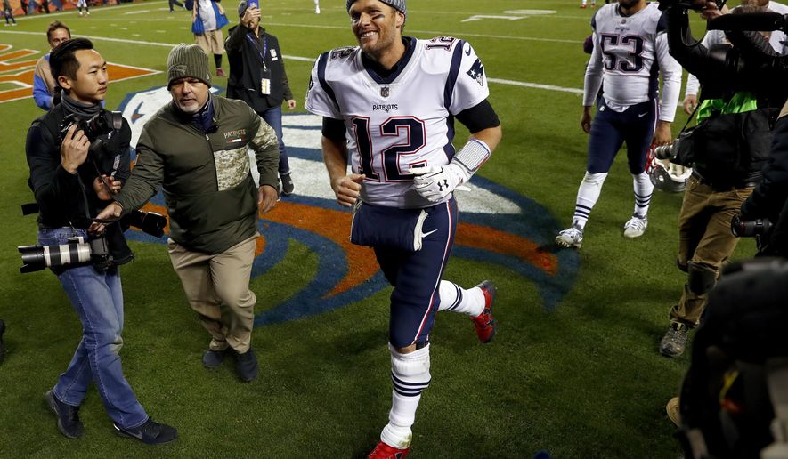 New England Patriots quarterback Tom Brady (12) cheers Patriots fans as he leaves the field after an NFL football game against the Denver Broncos, Sunday, Nov. 12, 2017, in Denver. The Patriots won 41-16. (AP Photo/David Zalubowski)
