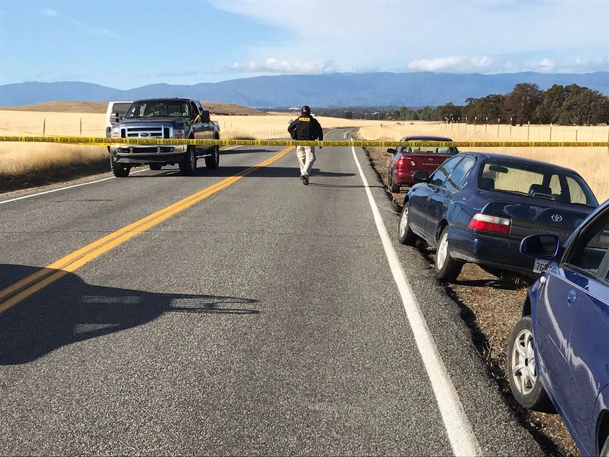 Crime tape blocks off Rancho Tehama Road leading into the Rancho Tehama subdivision south of Red Bluff, Calif., following a fatal shooting on Tuesday, Nov. 14, 2017. (Jim Schultz/The Record Searchlight via AP)
