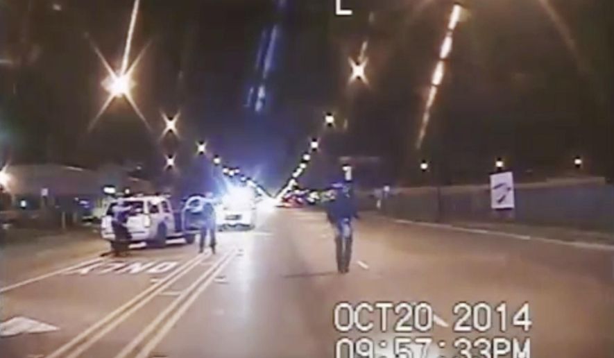 FILE - In this Oct. 20, 2014 file image taken from dash-cam video provided by the Chicago Police Department, Laquan McDonald, right, walks down the street moments before being fatally shot by Chicago Police officer Jason Van Dyke in Chicago. A special prosecutor has no plans to indict any more Chicago police officers who were present when Van Dyke shot McDonald, or took part in the investigation. The announcement means that the number of current or former officers charged in an alleged cover-up to protect Van Dyke stands at three (Chicago Police Department via AP, File)