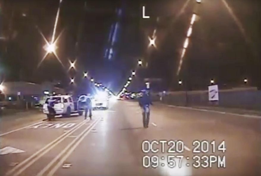 FILE - In this Oct. 20, 2014 file image taken from dash-cam video provided by the Chicago Police Department, Laquan McDonald, right, walks down the street moments before being fatally shot by Chicago Police officer Jason Van Dyke in Chicago. A special prosecutor has no plans to indict any more Chicago police officers who were present when Van Dyke shot McDonald, or took part in the investigation. The announcement means that the number of current or former officers charged in an alleged cover-up to protect Van Dyke stands at three (Chicago Police Department via AP, File)