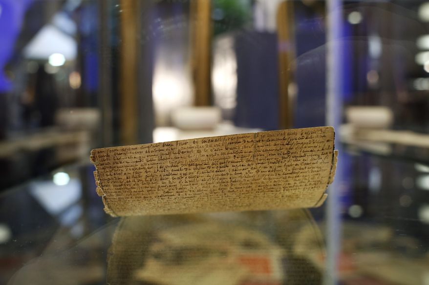 The original manuscript of "The 120 Days of Sodom, or the School of Libertinage," a scandalous and pornographic novel written by French writer Marquis de Sade while jailed in the Bastille prison is displayed prior to the auction of the Aristophil Collections, in Neuilly-sur-Seine, west of Paris, Tuesday, Nov. 14, 2017. Thousands of French private investors, victims of a vast pyramid scheme, hope to get some of their stake back when a huge collection of rare and valuable manuscripts begin to be auctioned in Paris next month by court order. (AP Photo/Thibault Camus)