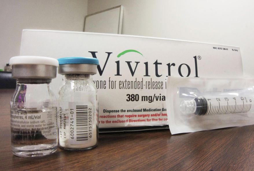 FILE - This Oct. 19, 2016, file photo shows the packaging of Vivitrol at an addiction treatment center in Joliet, Ill. The first U.S. study, published Tuesday, Nov. 14, 2017 in the journal Lancet, comparing Vivitrol and Suboxone, two opioid addiction treatment drugs, finds that a monthly shot works about the same as a daily drug. The shot requires days of detox and that proved to be a stumbling block for many. (AP Photo/Carla K. Johnson, File)