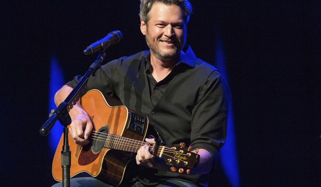 FILE - This June 7, 2016 file photo shows Blake Shelton performing at the 12th Annual Stars for Second Harvest Benefit at Ryman Auditorium in Nashville, Tenn. Shelton was named as People magazine&#x27;s 2017 &amp;quot;Sexiest Man Alive.&amp;quot;   (Photo by Amy Harris/Invision/AP, File)