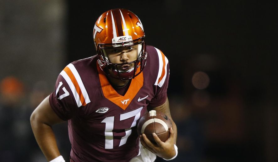 This Oct. 28, 2017 photo shows Virginia Tech quarterback Josh Jackson (17) running downfield during the first half of an NCAA college football game in Blacksburg, Va. Back-to-back losses have taken Virginia Tech out of contention for the ACC’s Coastal Division championship, but Jackson says the team still has a lot of motivation to finish strong. Win their last three, he said, and it will be another 10-win season. (AP Photo/Steve Helber) **FILE**