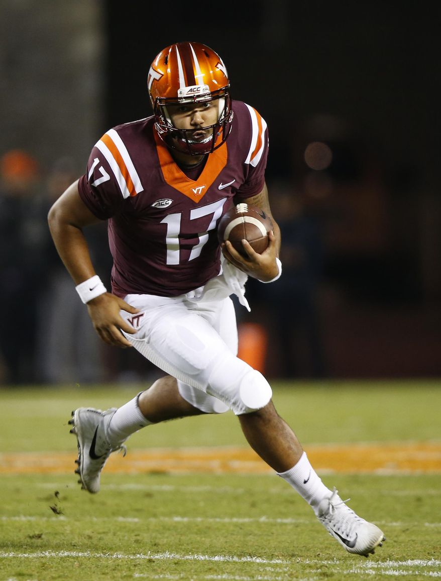 This Oct. 28, 2017 photo shows Virginia Tech quarterback Josh Jackson (17) running downfield during the first half of an NCAA college football game in Blacksburg, Va. Back-to-back losses have taken Virginia Tech out of contention for the ACC’s Coastal Division championship, but Jackson says the team still has a lot of motivation to finish strong. Win their last three, he said, and it will be another 10-win season. (AP Photo/Steve Helber) **FILE**