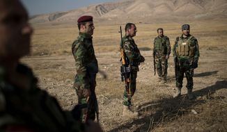 Kurdish leaders remain committed to a political settlement but say their famed peshmerga militia forces are ready to take up arms to defend their homeland. (Associated Press/File)