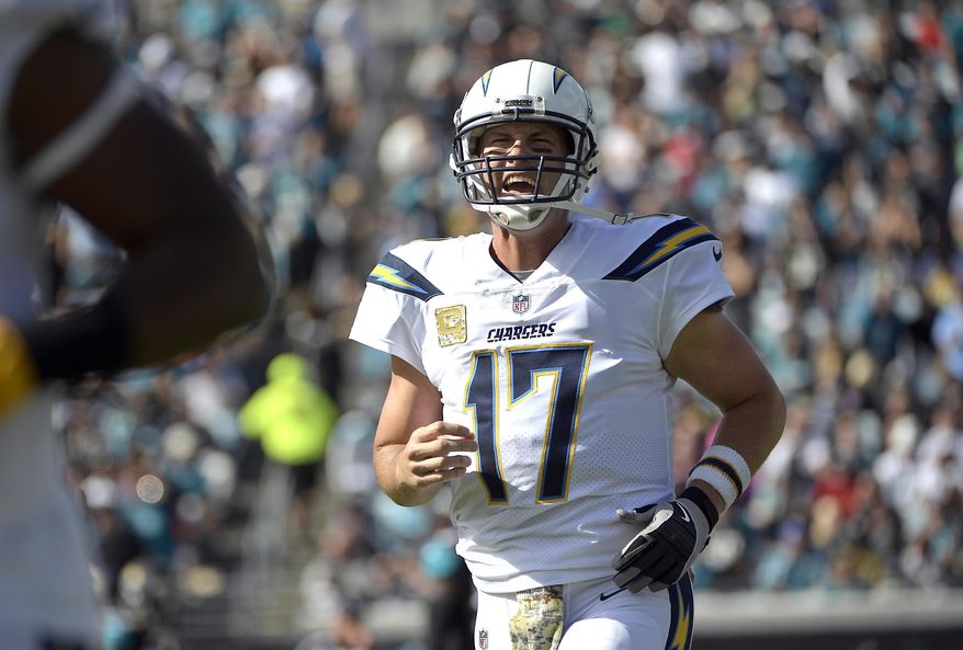 FILE - In this Sunday, Nov. 12, 2017, file photo, Los Angeles Chargers quarterback Philip Rivers shouts to teammates during the first half of an NFL football game against the Jacksonville Jaguars in Jacksonville, Fla. Rivers is in the NFL's concussion protocol after experiencing possible symptoms of a head injury, endangering his streak of 194 consecutive starts since 2006. Rivers told the Chargers about his symptoms Monday after they returned from a 20-17 overtime loss in Jacksonville, coach Anthony Lynn said. (AP Photo/Phelan M. Ebenhack, File)