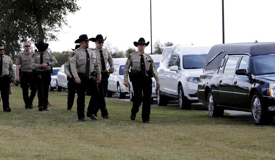 Mourners arrive at the Floresville Event Center to attend a funeral for members of the Holcombe family who were killed in the Sutherland Springs Baptist Church shooting, Wednesday, Nov. 15, 2017, in Floresville, Texas. A man opened fire inside the church in the small South Texas community Sunday, Nov. 5, killing more than two dozen. (AP Photo/Eric Gay)