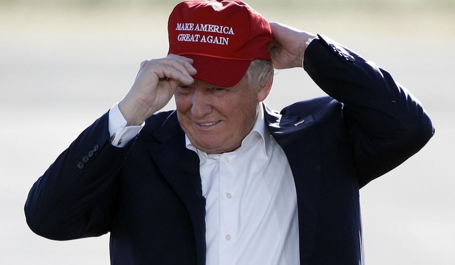 FILE - In this June 1, 2016, file photo, Republican presidential candidate Donald Trump wears his &quot;Make America Great Again&quot; hat at a rally in Sacramento, Calif. Hats with the now popular slogan is a possible gift idea for this holiday season. (AP Photo/Jae C. Hong, File)