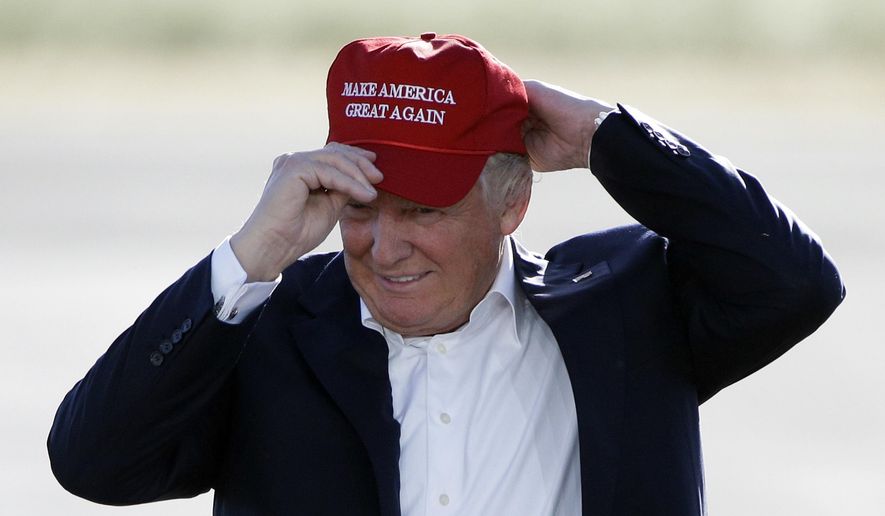 In this June 1, 2016, file photo, Republican presidential candidate Donald Trump wears his &amp;quot;Make America Great Again&amp;quot; hat at a rally in Sacramento, Calif. Hats with the now popular slogan is a possible gift idea for this holiday season. (AP Photo/Jae C. Hong, File)