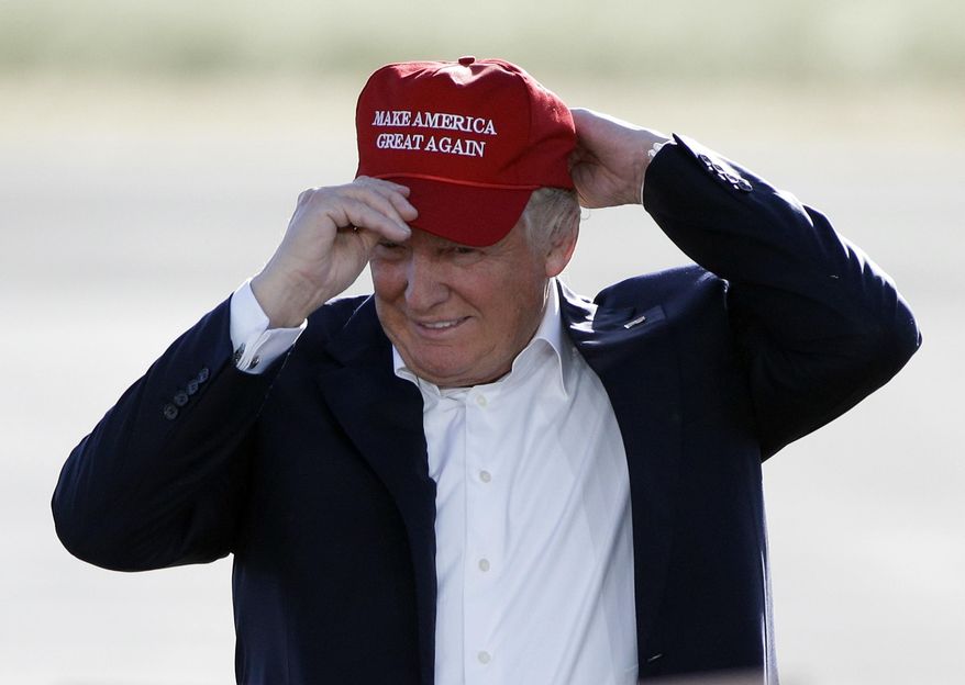 In this June 1, 2016, file photo, Republican presidential candidate Donald Trump wears his &amp;quot;Make America Great Again&amp;quot; hat at a rally in Sacramento, Calif. Hats with the now popular slogan is a possible gift idea for this holiday season. (AP Photo/Jae C. Hong, File)