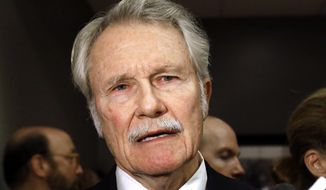 FILE - In this Oct. 10, 2014, file photo, Oregon Gov. John Kitzhaber talks to reporters before a debate in Portland, Ore. Former Gov. Kitzhaber has agreed with the state&#39;s ethics commission to pay a $1,000 fine for allegedly violating ethics codes by failing to publicly declare a potential conflict of interest and for claiming airline travel miles for personal use that accumulated while on official business during his tenure. (AP Photo/Don Ryan, File)
