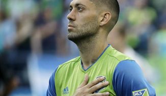 FILE - In this Aug. 21, 2016, file photo, Seattle Sounders forward Clint Dempsey holds his hand over his heart during the national anthem before an MLS soccer match against the Portland Timbers in Seattle. Dempsey, who missed the rest of the 2016 season with a heart condition, has been named the MLS Comeback Player of the Year after scoring 12 goals in the 2017 regular season and leading Seattle to a second-place finish in the MLS Western Conference. The Sounders will face Houston in the Western Conference finals beginning Nov. 21, 2017. (AP Photo/Ted S. Warren, file)