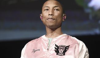 FILE - In this April 22, 2017 file photo, Pharrell Williams performs at To the Rescue! Los Angeles Human Society Benefit in Los Angeles. Williams is using music to sound the warning about climate change. The Grammy-winning musician appeared in Shanghai to debut a song titled “100 Years.&amp;quot; (Photo by Richard Shotwell/Invision/AP)
